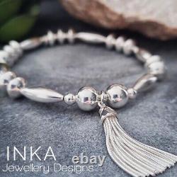 Inka Sterling Silver Chunky Oval bead Stacking Bracelet with Large Tassel charm