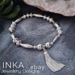 Inka Sterling Silver Chunky Oval bead Stacking Bracelet with Large Tassel charm