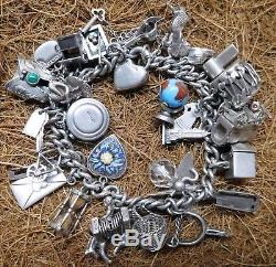 Vintage Heavy Sterling Silver Charm Bracelet With 30 Charms 2 Ounces of Silver