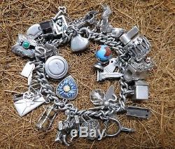 Vintage Heavy Sterling Silver Charm Bracelet With 30 Charms 2 Ounces of Silver